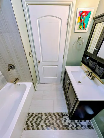 a bathroom with a bathtub and a shower