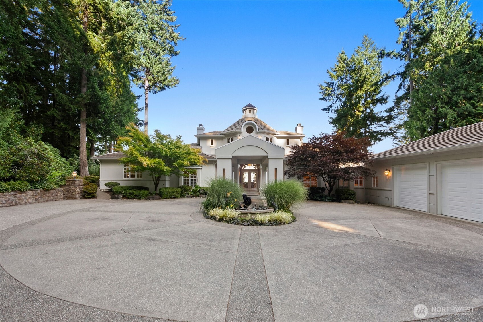 13020 Thomas Road Northwest Gig Harbor, WA 98329 - Photo 11 of 37 a front view of a house with a yard and a garden