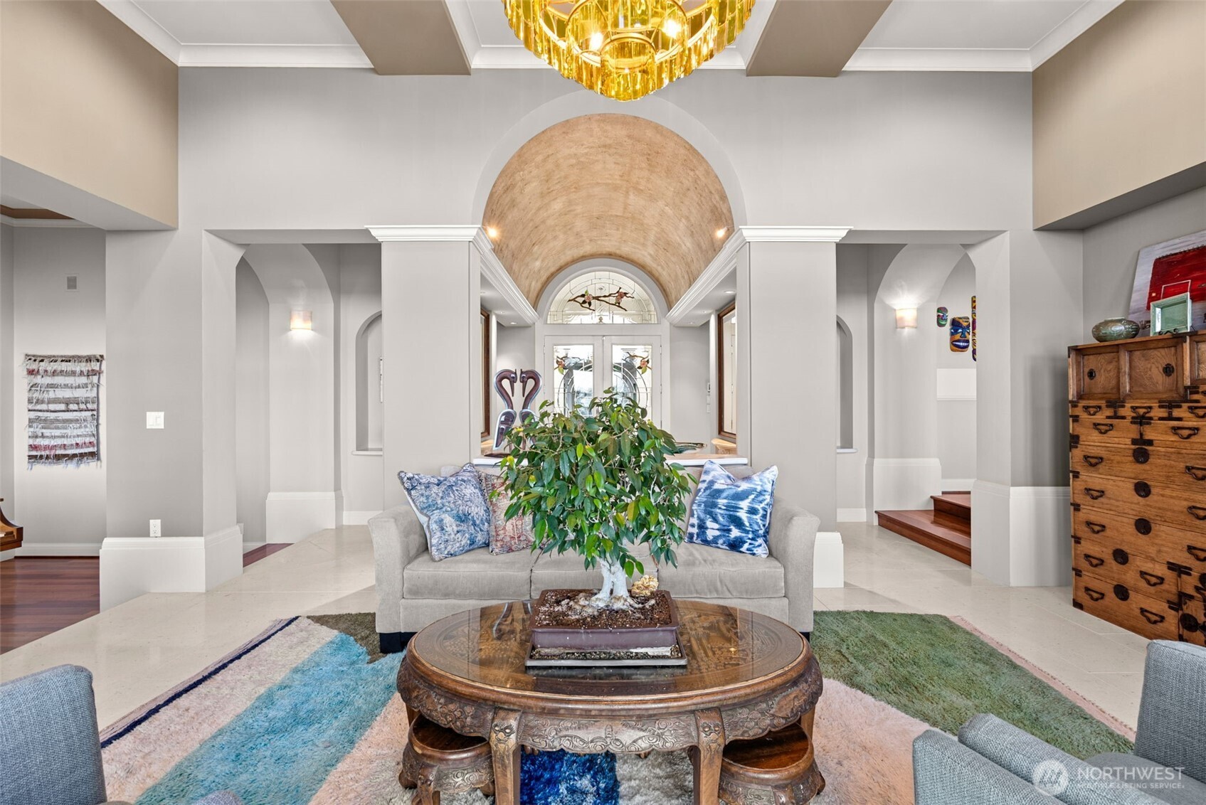 13020 Thomas Road Northwest Gig Harbor, WA 98329 - Photo 15 of 37 a living room with furniture and a chandelier