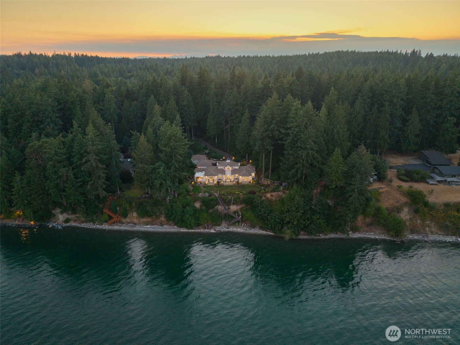 13020 Thomas Road Northwest Gig Harbor, WA 98329 - Photo 2 of 37 a view of a lake with a mountain in the background