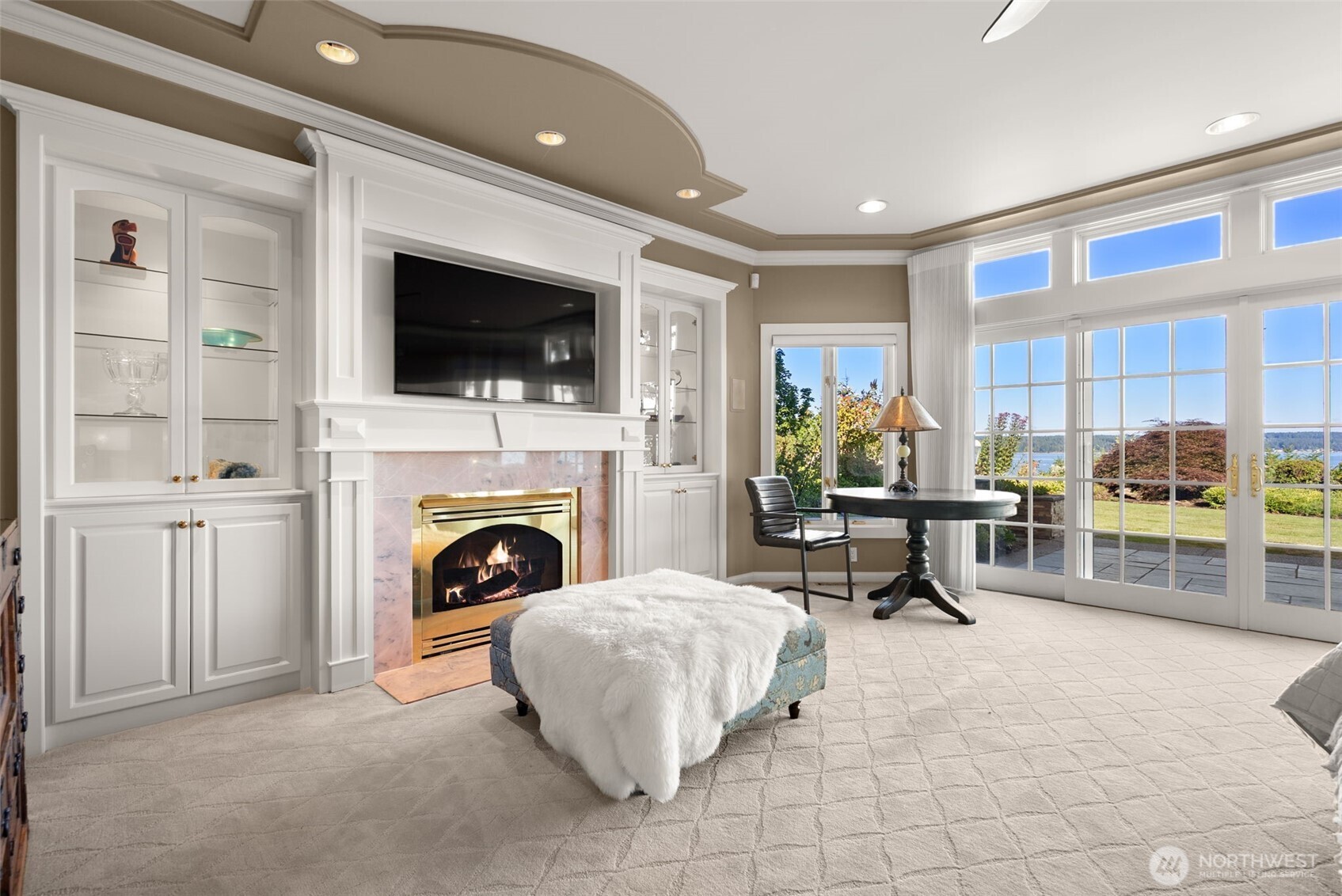 13020 Thomas Road Northwest Gig Harbor, WA 98329 - Photo 21 of 37 a living room with furniture a flat screen tv and a fireplace