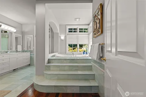 a bath tub sitting in front of a window