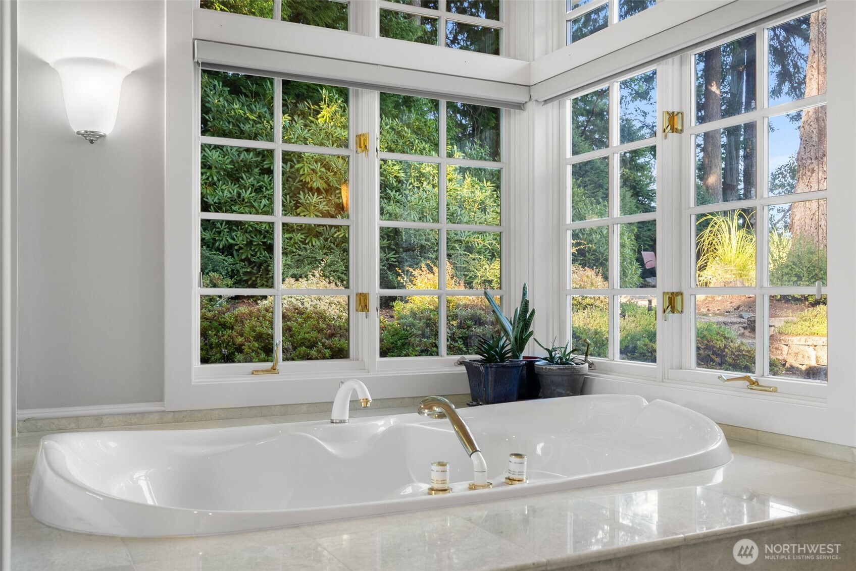 13020 Thomas Road Northwest Gig Harbor, WA 98329 - Photo 24 of 37 a bath tub sitting in front of a window