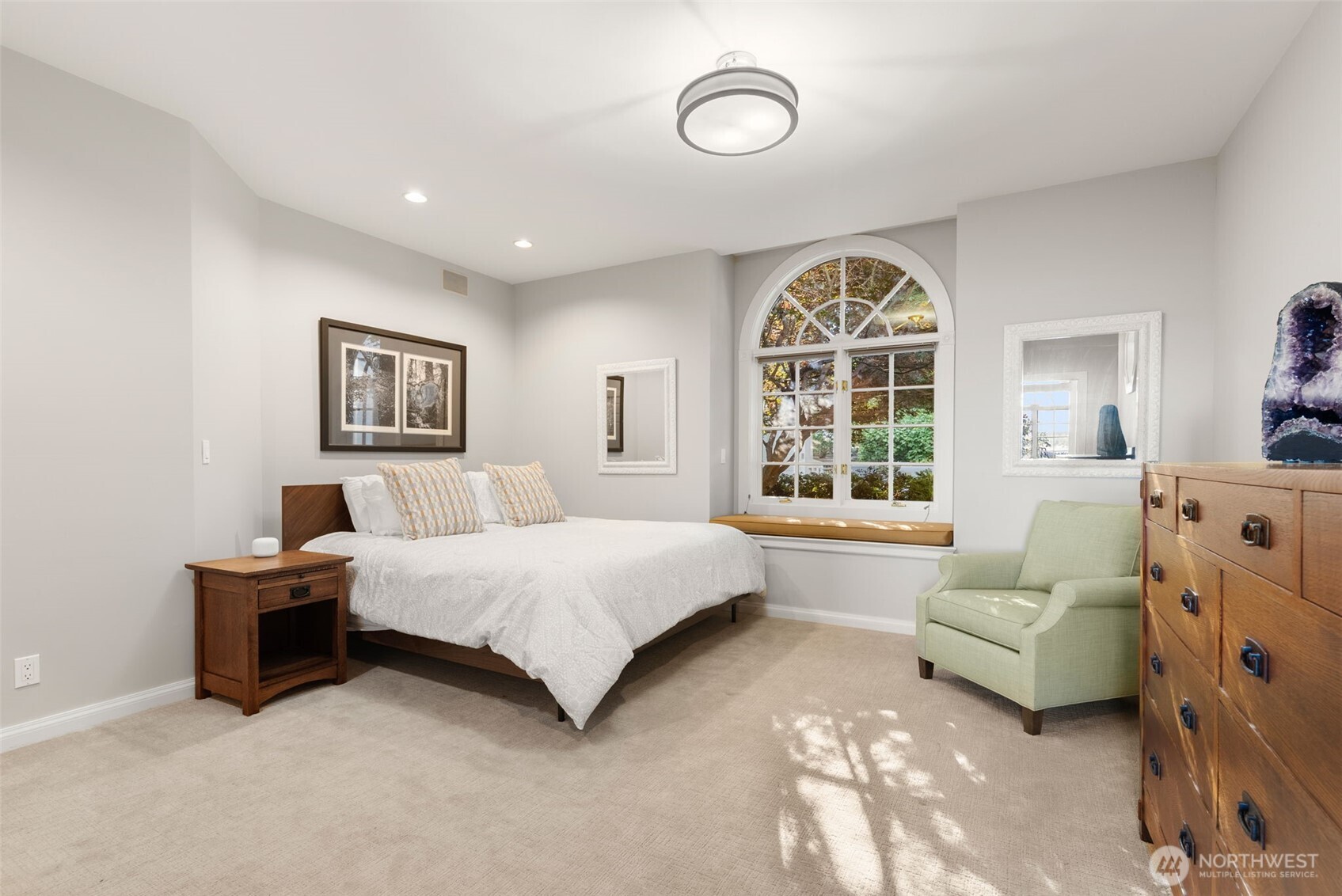 13020 Thomas Road Northwest Gig Harbor, WA 98329 - Photo 26 of 37 a spacious bedroom with a bed and a large window