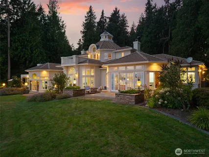 an aerial view of residential house with outdoor space and swimming pool