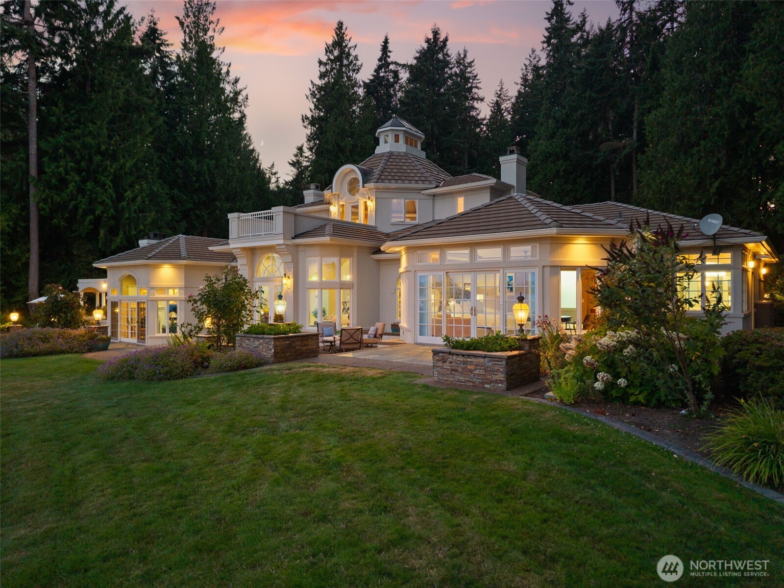 13020 Thomas Road Northwest Gig Harbor, WA 98329 - Photo 3 of 37 a front view of a house with swimming pool having outdoor seating