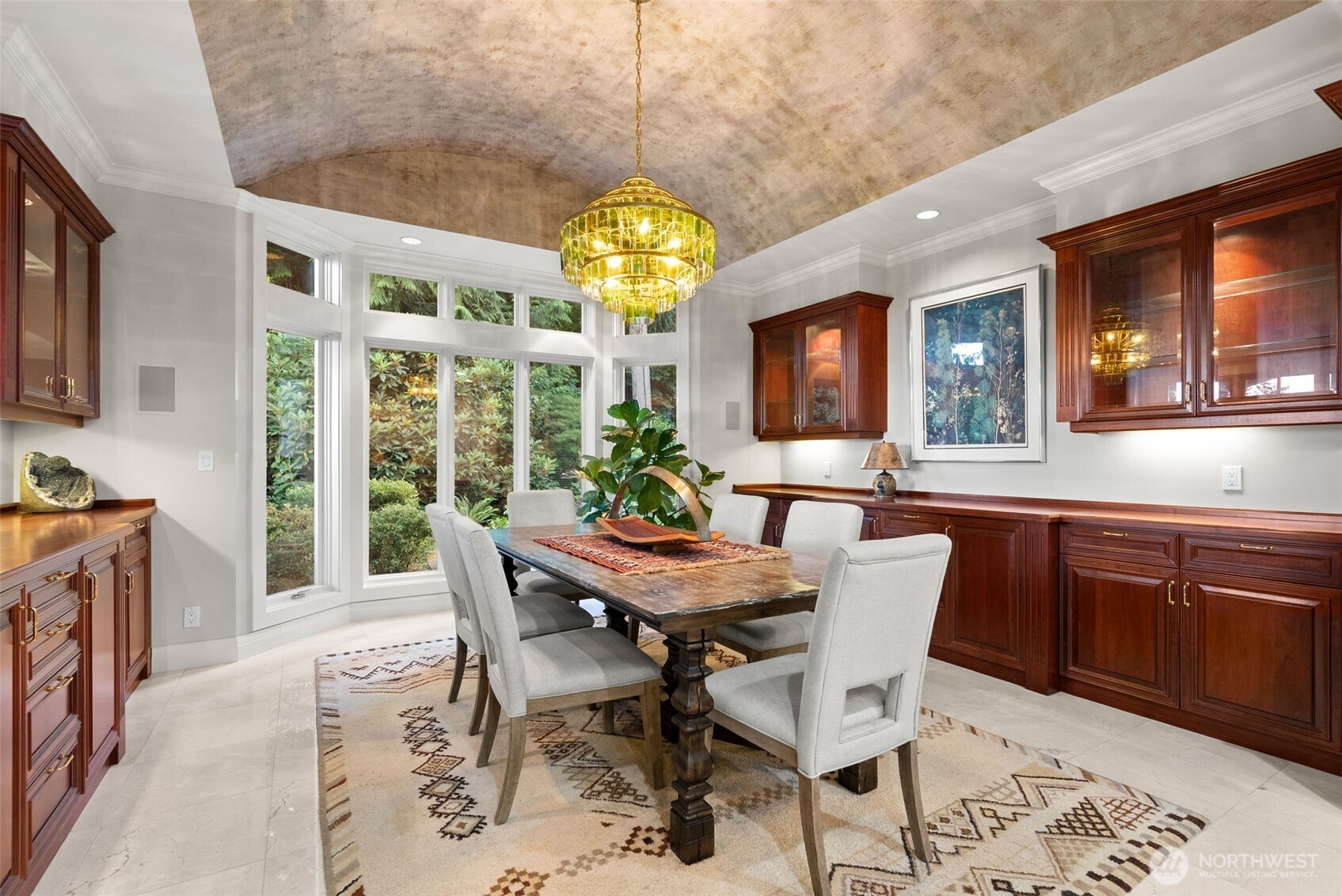 13020 Thomas Road Northwest Gig Harbor, WA 98329 - Photo 32 of 37 a view of a dining room with furniture a chandelier and wooden floor