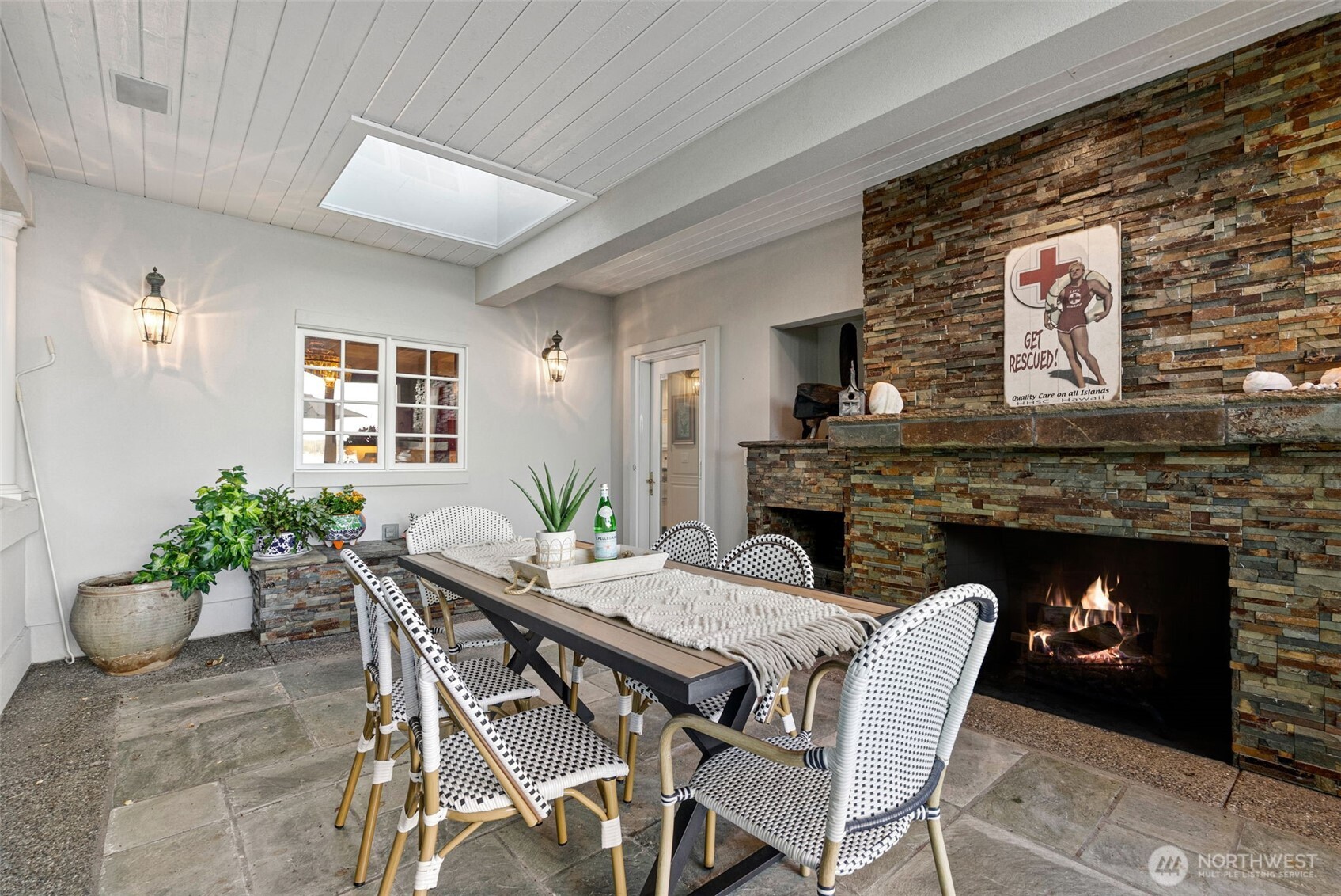 13020 Thomas Road Northwest Gig Harbor, WA 98329 - Photo 33 of 37 a dining room with furniture and a fireplace