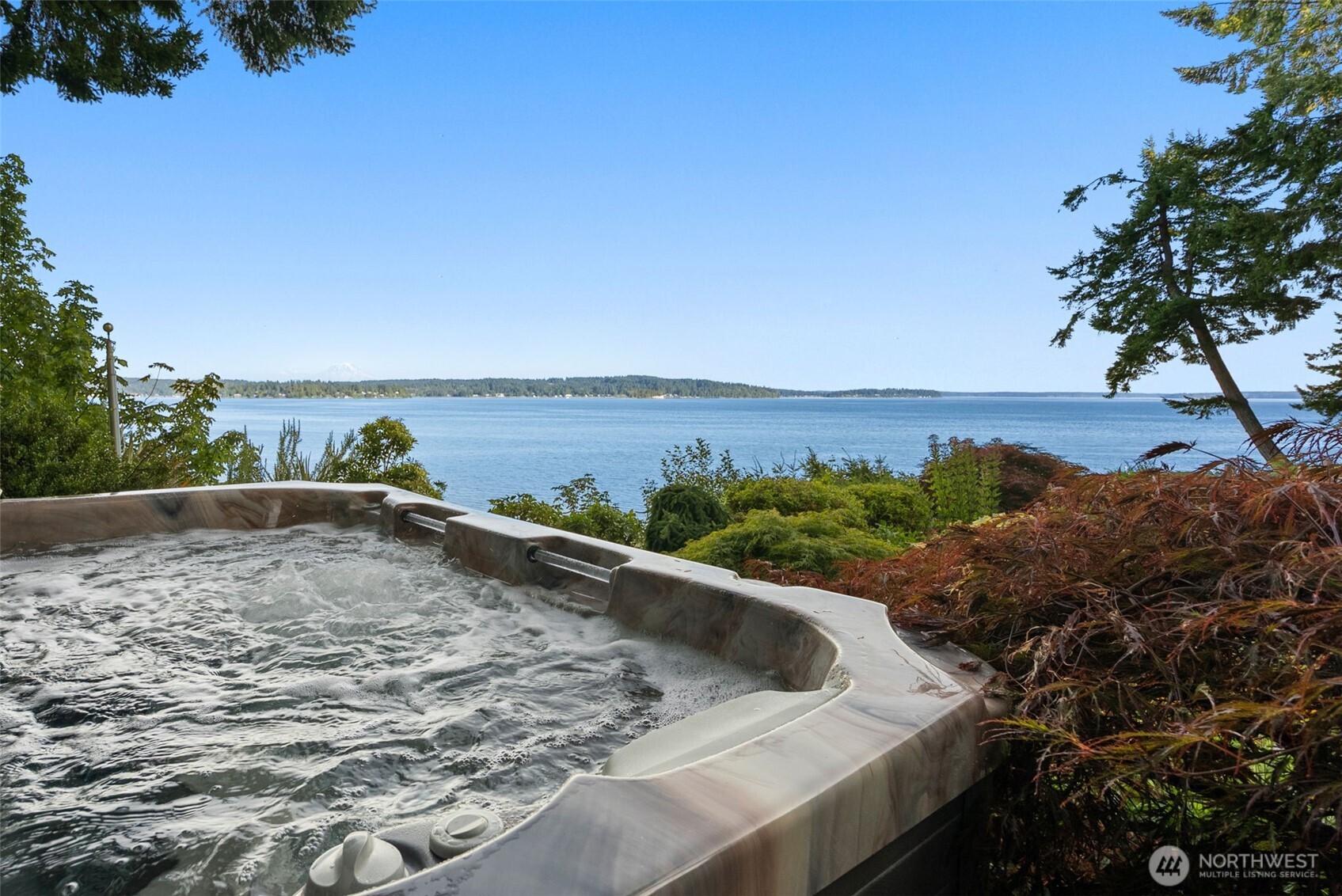 13020 Thomas Road Northwest Gig Harbor, WA 98329 - Photo 36 of 37 a view of a swimming pool with a lake view