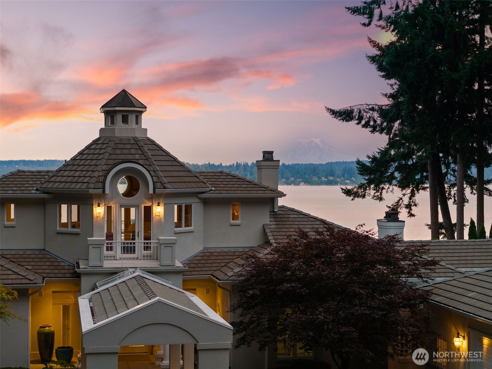 13020 Thomas Road Northwest Gig Harbor, WA 98329 - Photo 5 of 37 a front view of a house with a garden