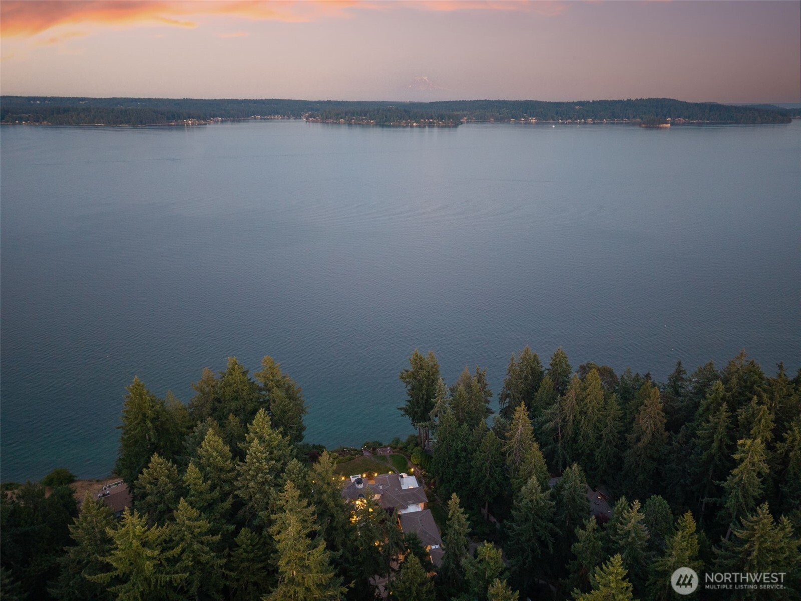 13020 Thomas Road Northwest Gig Harbor, WA 98329 - Photo 6 of 37 a view of a lake from a yard