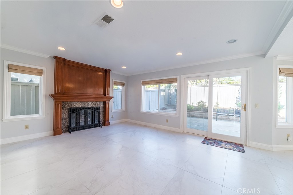 23971 Frigate Drive Laguna Niguel, CA 92677 - Photo 11 of 48 an empty room with fireplace and windows