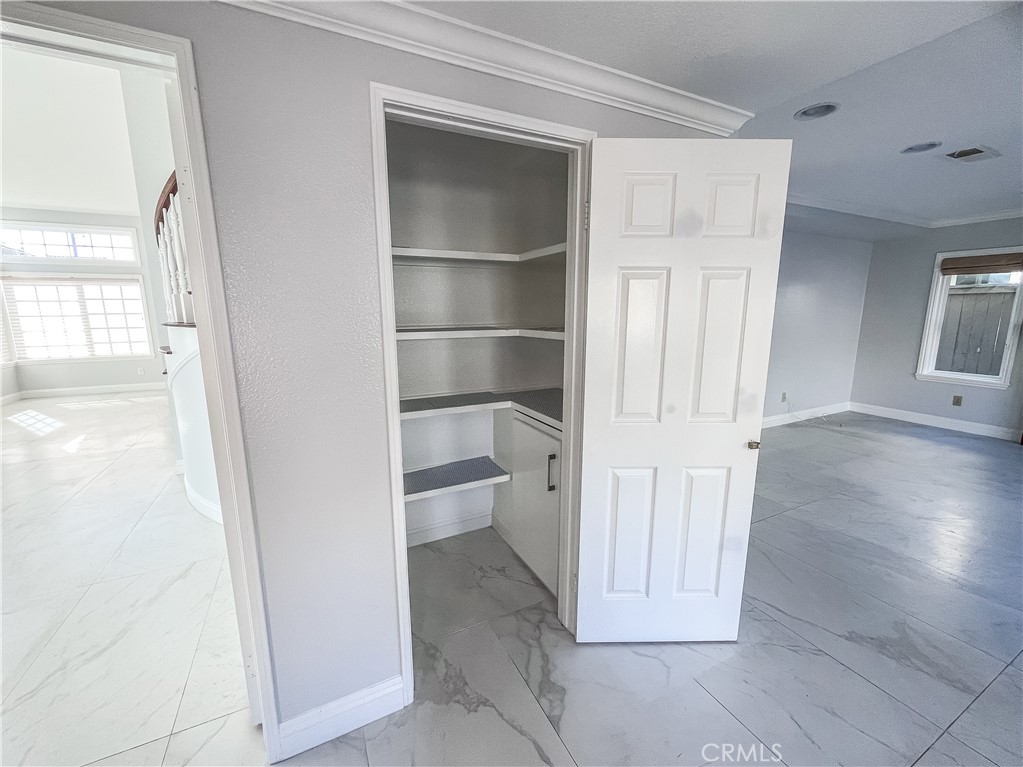 23971 Frigate Drive Laguna Niguel, CA 92677 - Photo 17 of 48 a view of a hallway with wooden floor and closet