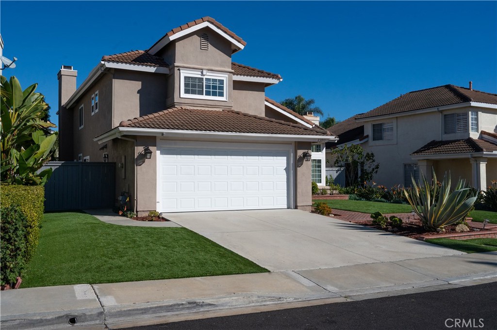 23971 Frigate Drive Laguna Niguel, CA 92677 - Photo 2 of 48 a front view of a house with a yard and garage