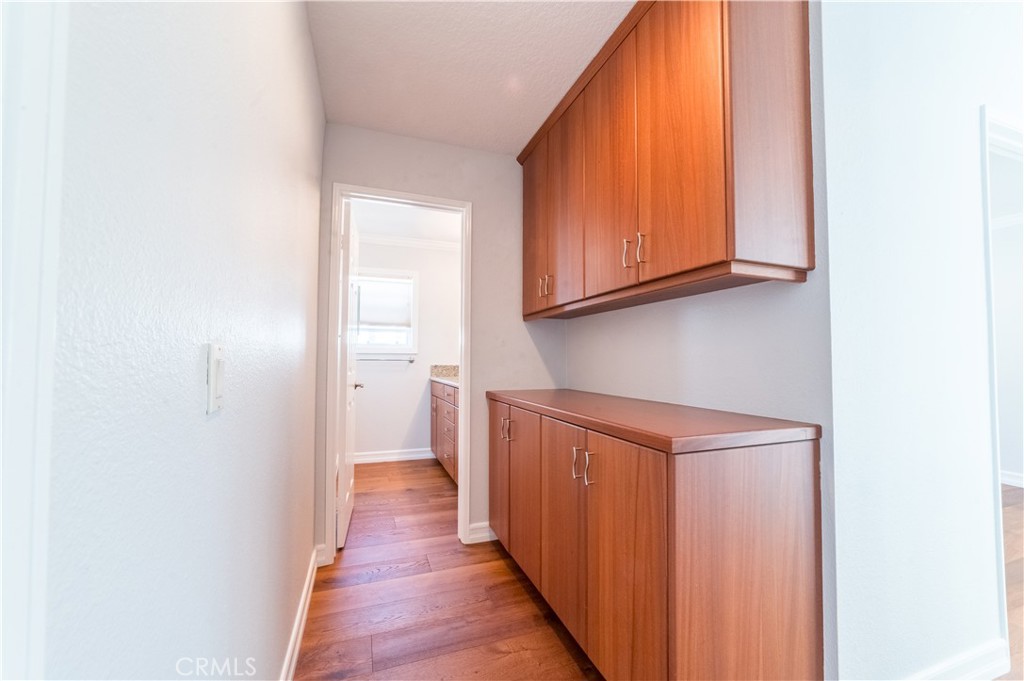 23971 Frigate Drive Laguna Niguel, CA 92677 - Photo 21 of 48 a hallway with wooden cabinets