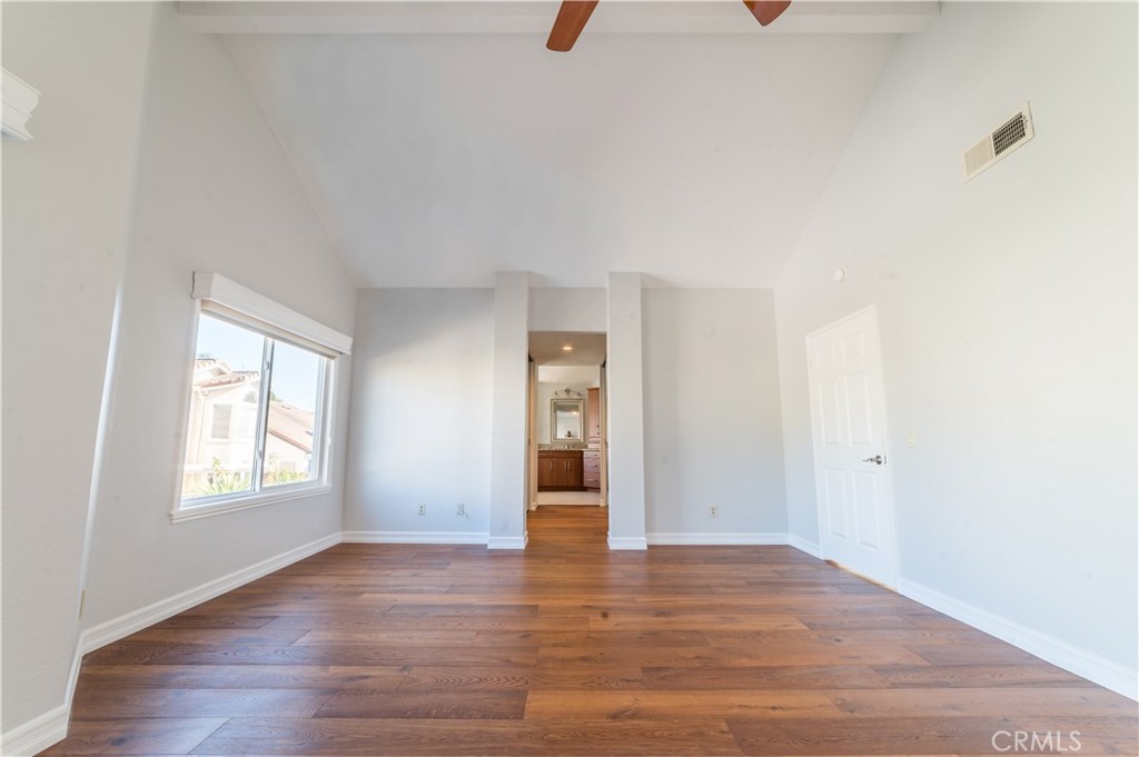 23971 Frigate Drive Laguna Niguel, CA 92677 - Photo 24 of 48 an empty room with wooden floor and windows
