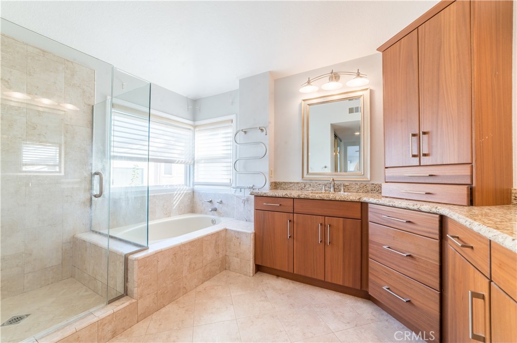 23971 Frigate Drive Laguna Niguel, CA 92677 - Photo 25 of 48 a bathroom with a tub sink and mirror