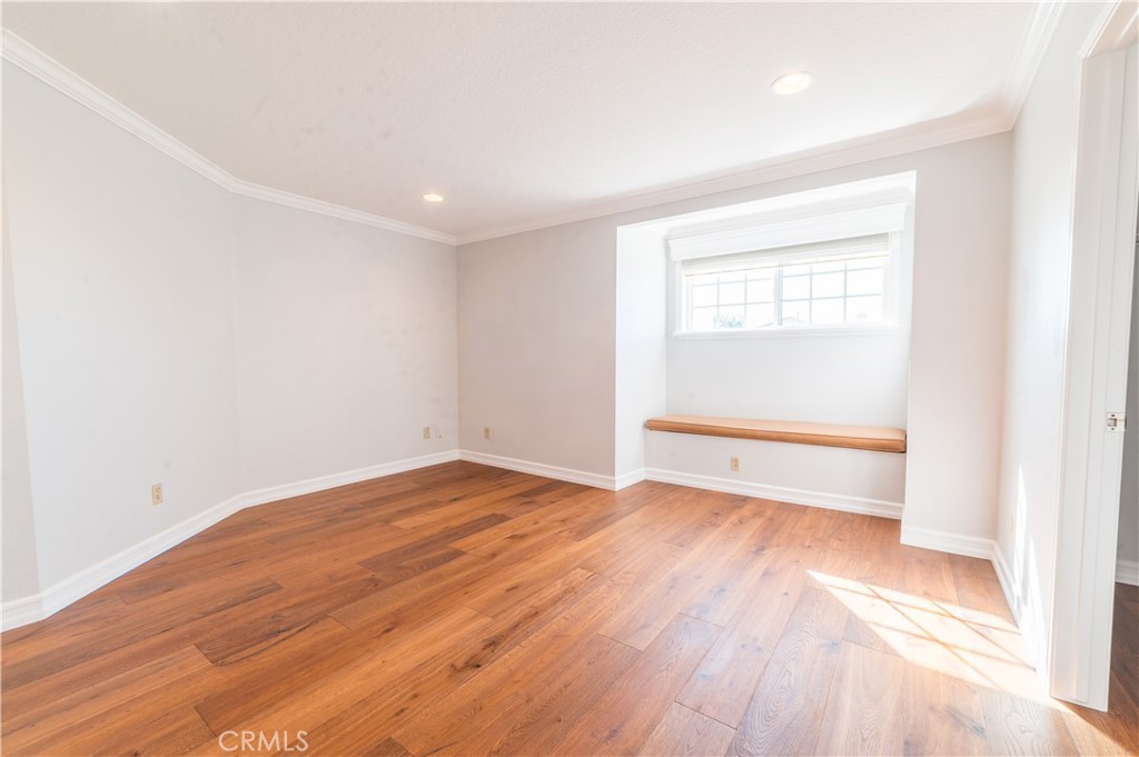 23971 Frigate Drive Laguna Niguel, CA 92677 - Photo 36 of 48 an empty room with wooden floor and windows