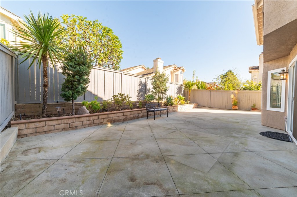 23971 Frigate Drive Laguna Niguel, CA 92677 - Photo 40 of 48 a view of a house with a backyard and a garage