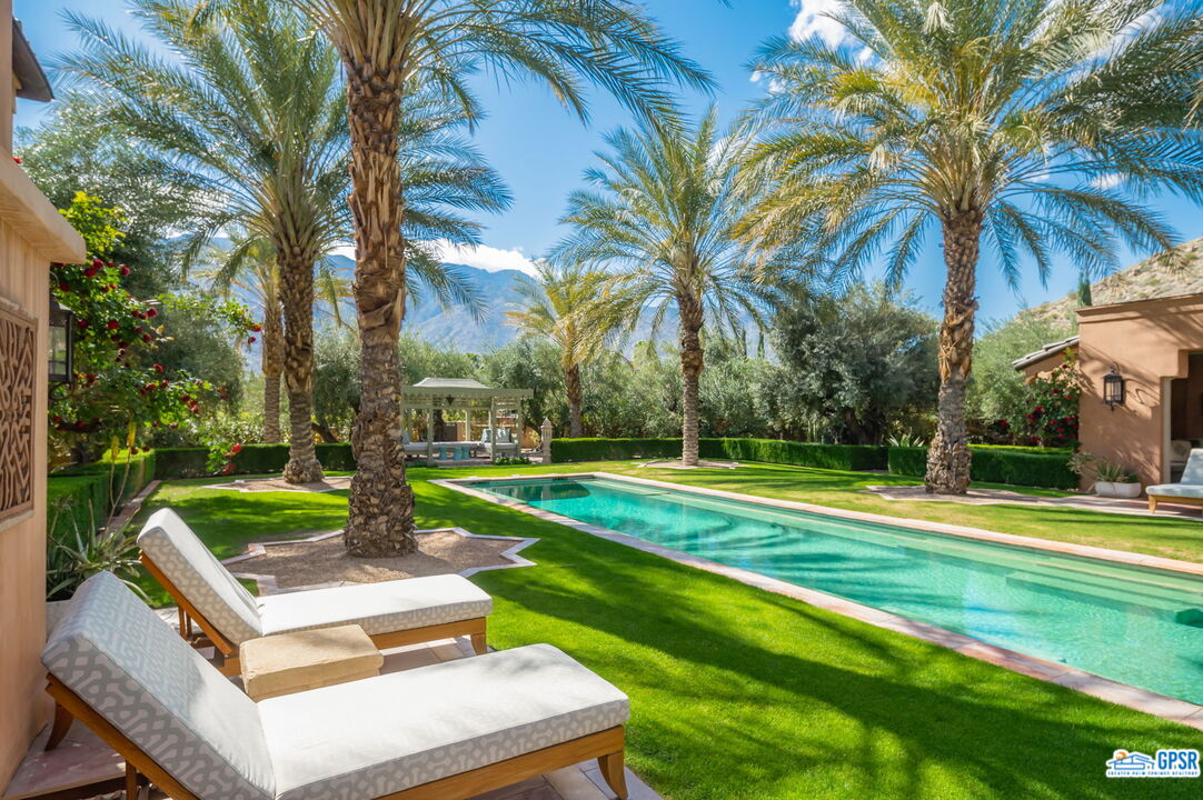 1650 Ave Sevilla Palm Springs, CA 92264 - Photo 20 of 74 a view of a yard with palm trees