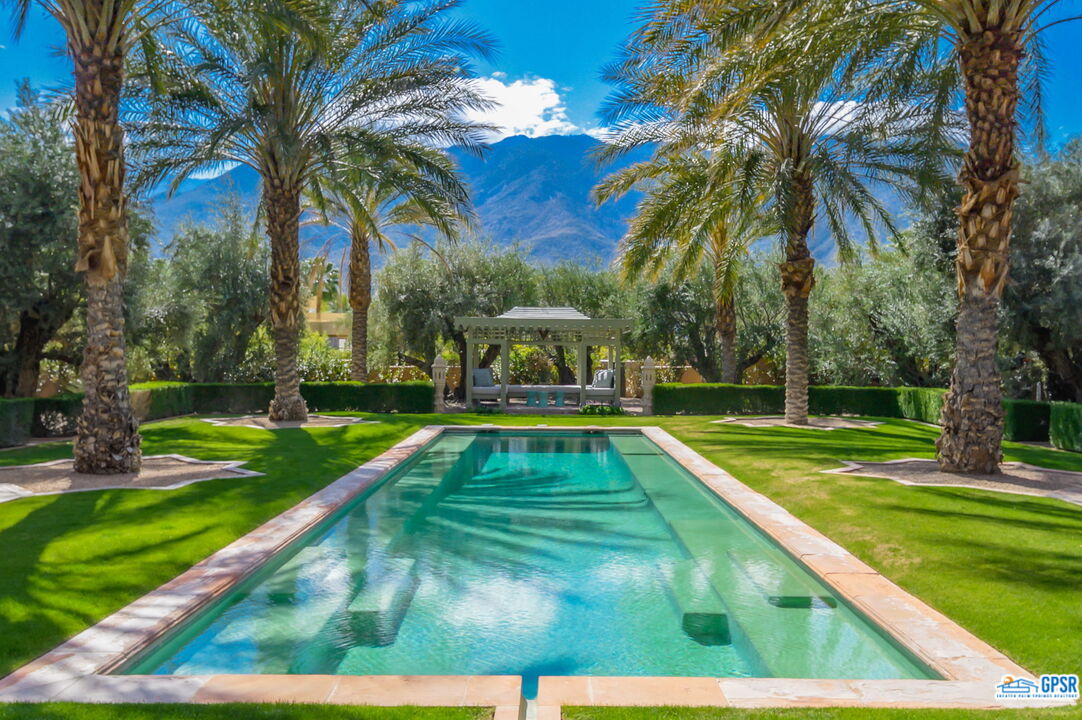 1650 Ave Sevilla Palm Springs, CA 92264 - Photo 2 of 74 a view of a yard with swimming pool