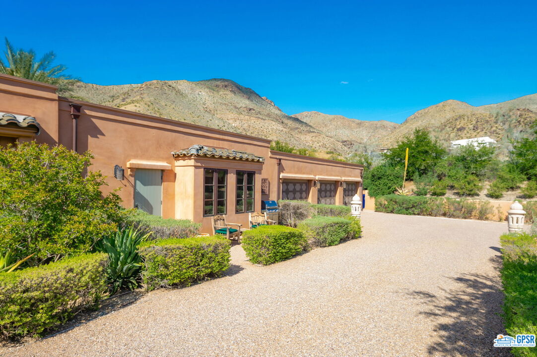 1650 Ave Sevilla Palm Springs, CA 92264 - Photo 25 of 74 a front view of a house with a yard