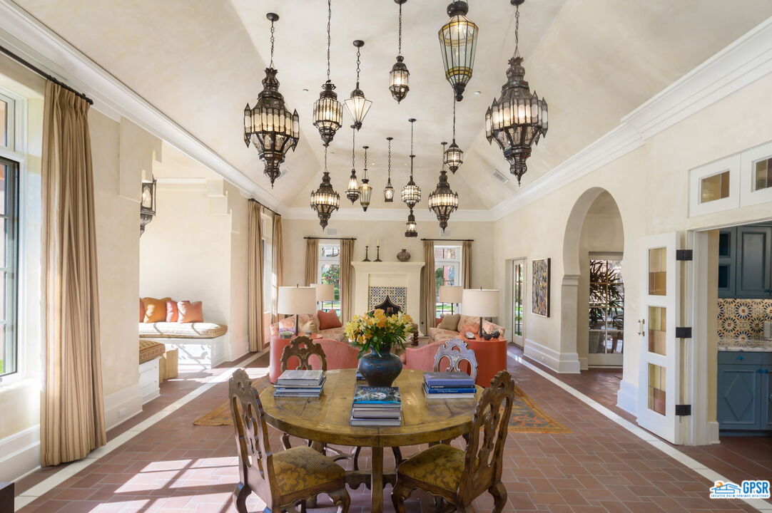 1650 Ave Sevilla Palm Springs, CA 92264 - Photo 26 of 74 a view of a dining room with furniture and chandelier