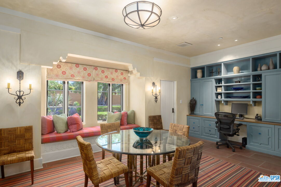 1650 Ave Sevilla Palm Springs, CA 92264 - Photo 33 of 74 a view of a dining room with furniture window and wooden floor