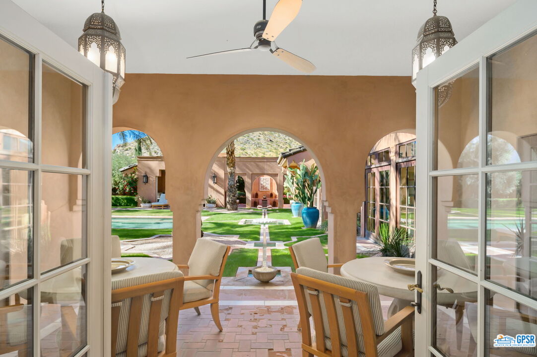 1650 Ave Sevilla Palm Springs, CA 92264 - Photo 38 of 74 a view of a dining room with furniture window and outside view