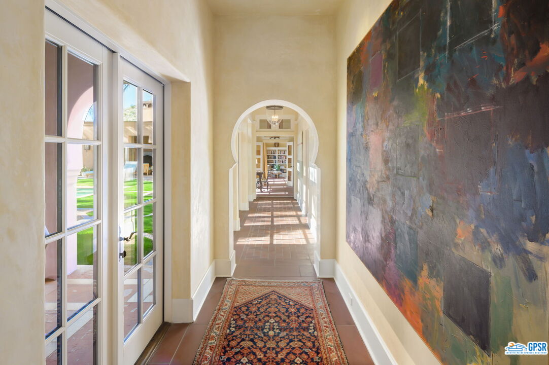 1650 Ave Sevilla Palm Springs, CA 92264 - Photo 39 of 74 a view of a hallway with windows