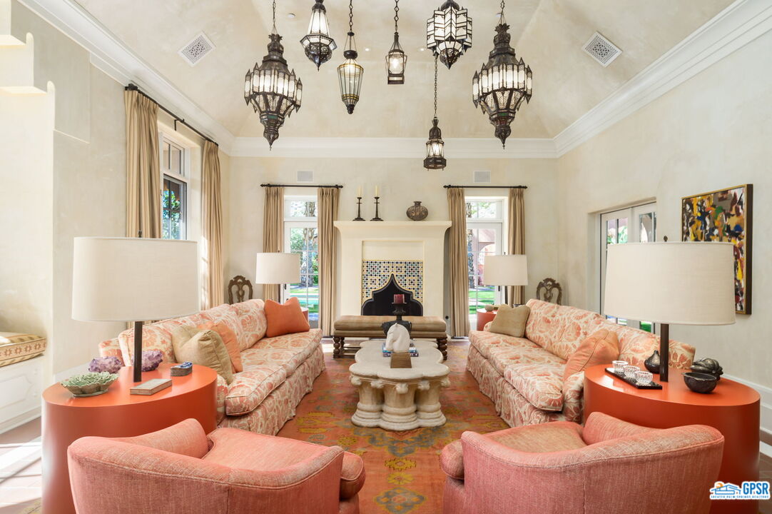1650 Ave Sevilla Palm Springs, CA 92264 - Photo 4 of 74 a living room with furniture fireplace and a window