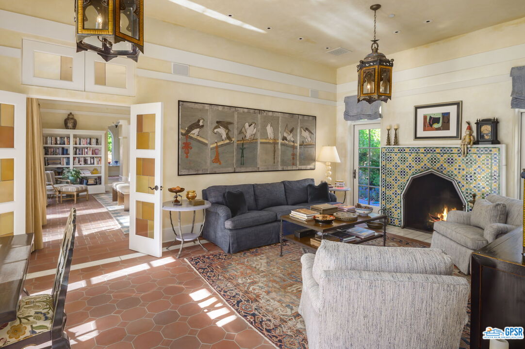 1650 Ave Sevilla Palm Springs, CA 92264 - Photo 42 of 74 a living room with furniture and a fireplace