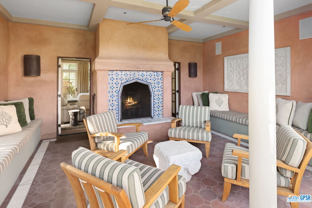 1650 Ave Sevilla Palm Springs, CA 92264 - Photo 56 of 74 a living room with furniture and a fireplace