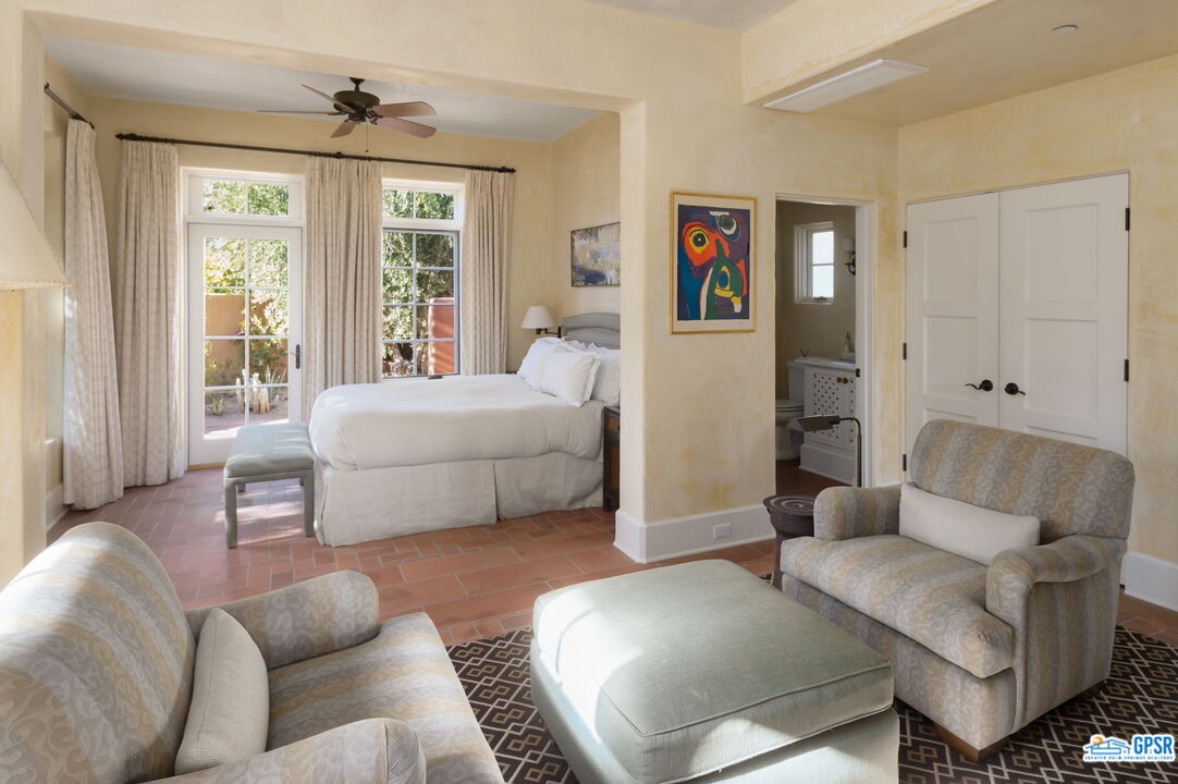 1650 Ave Sevilla Palm Springs, CA 92264 - Photo 57 of 74 a living room with furniture and a large window