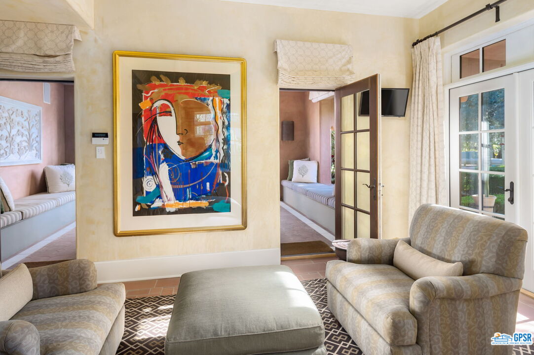 1650 Ave Sevilla Palm Springs, CA 92264 - Photo 58 of 74 a living room with furniture and a window