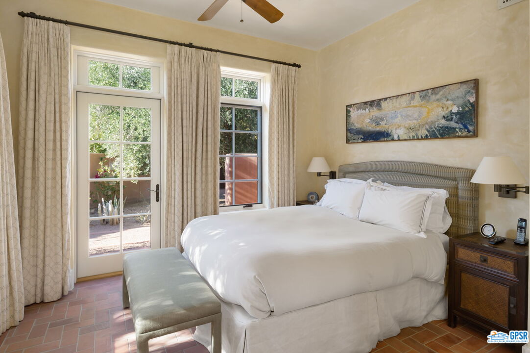 1650 Ave Sevilla Palm Springs, CA 92264 - Photo 59 of 74 a bedroom with a large bed and a window