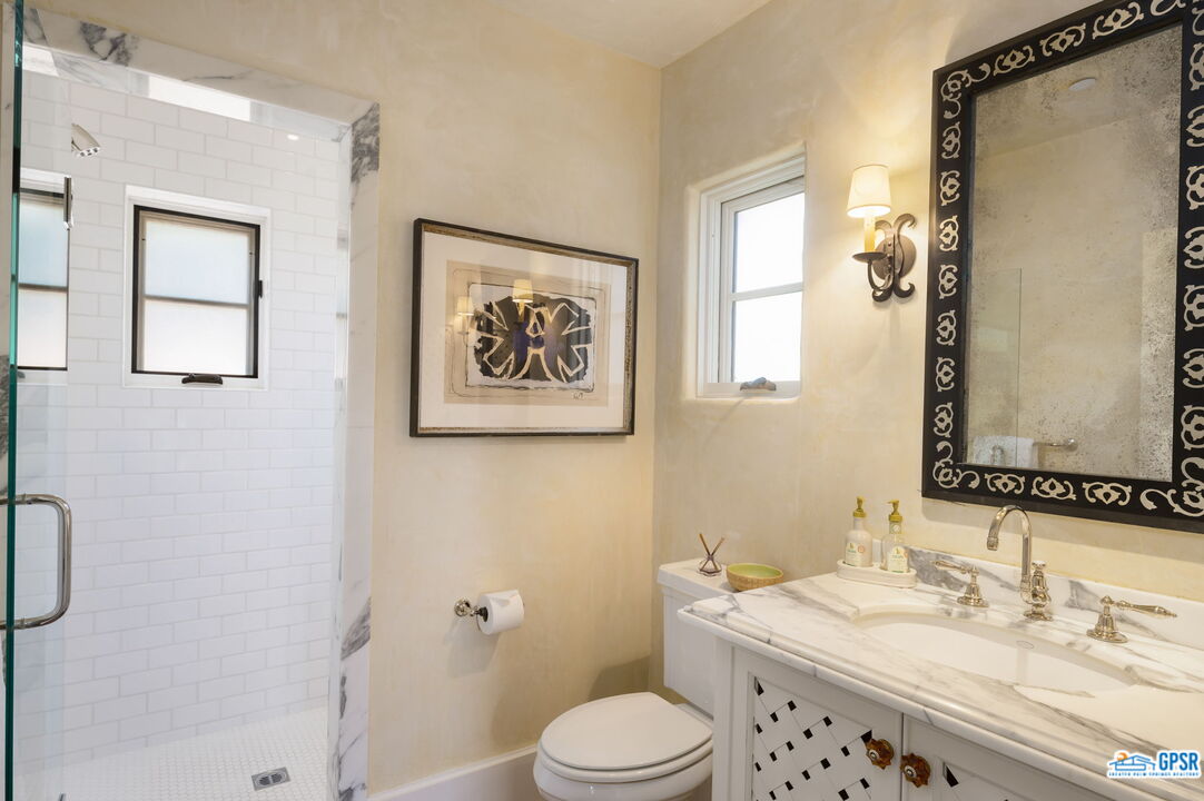 1650 Ave Sevilla Palm Springs, CA 92264 - Photo 60 of 74 a bathroom with a sink a toilet and shower