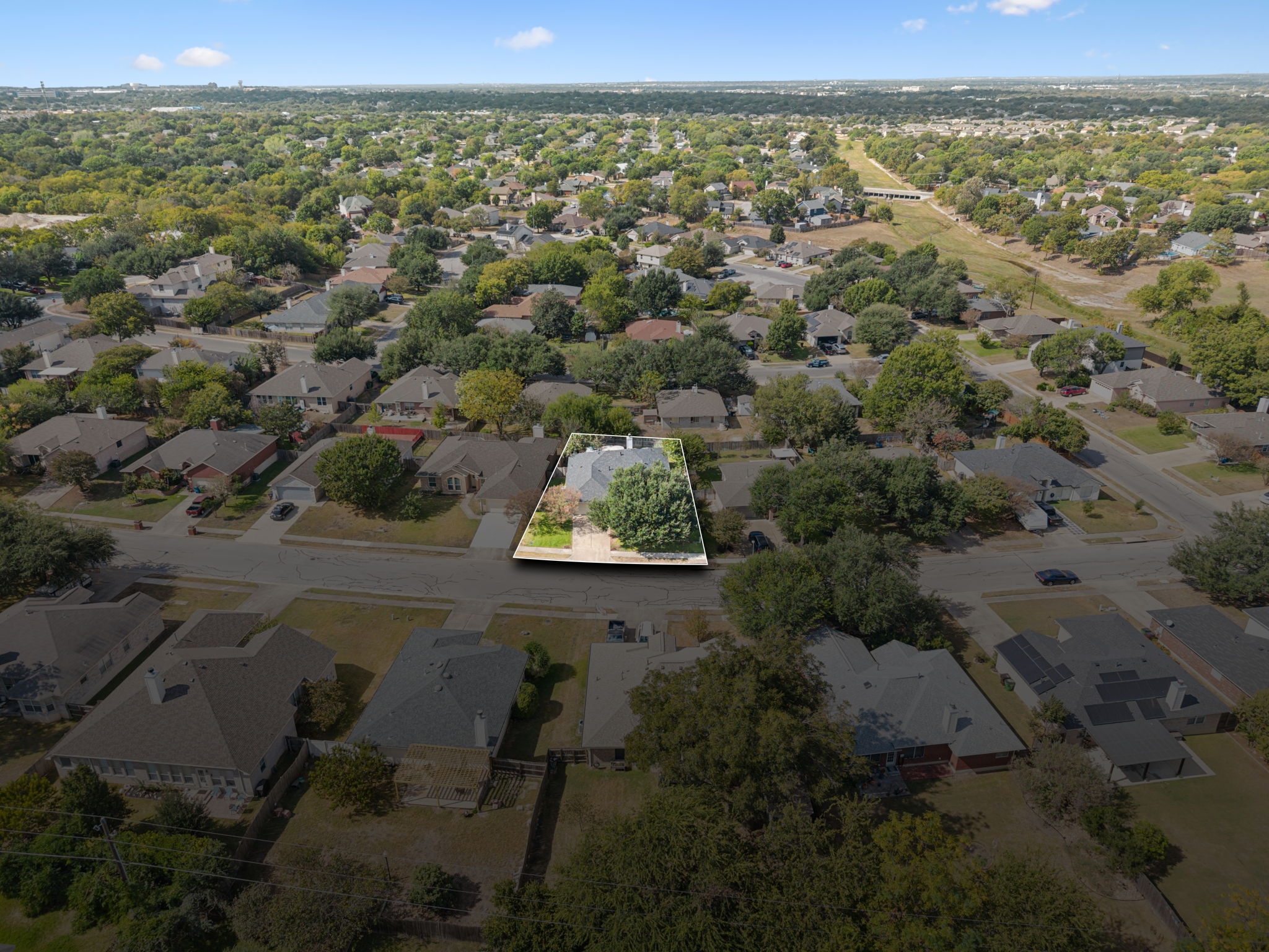 2412 Chestnut Path Round Rock, TX 78664 - Photo 25 of 26 An aerial perspective reveals a vibrant neighborhood nestled among mature trees and winding streets.