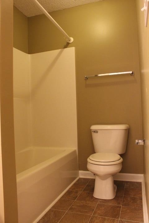 916 Granny White Road Clarksville, TN 37040 - Photo 11 of 19 a bathroom with a toilet and a shower