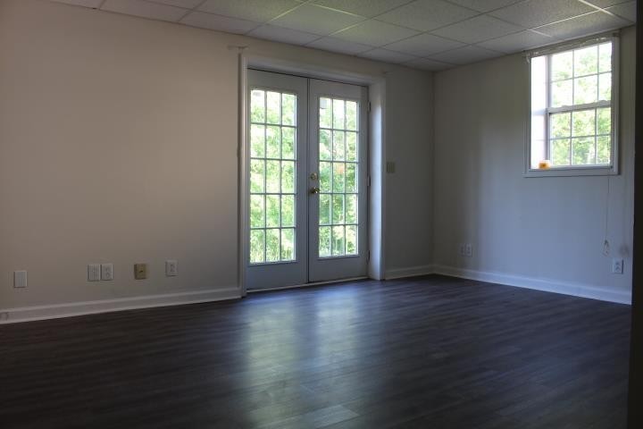 916 Granny White Road Clarksville, TN 37040 - Photo 19 of 19 an empty room with wooden floor and windows