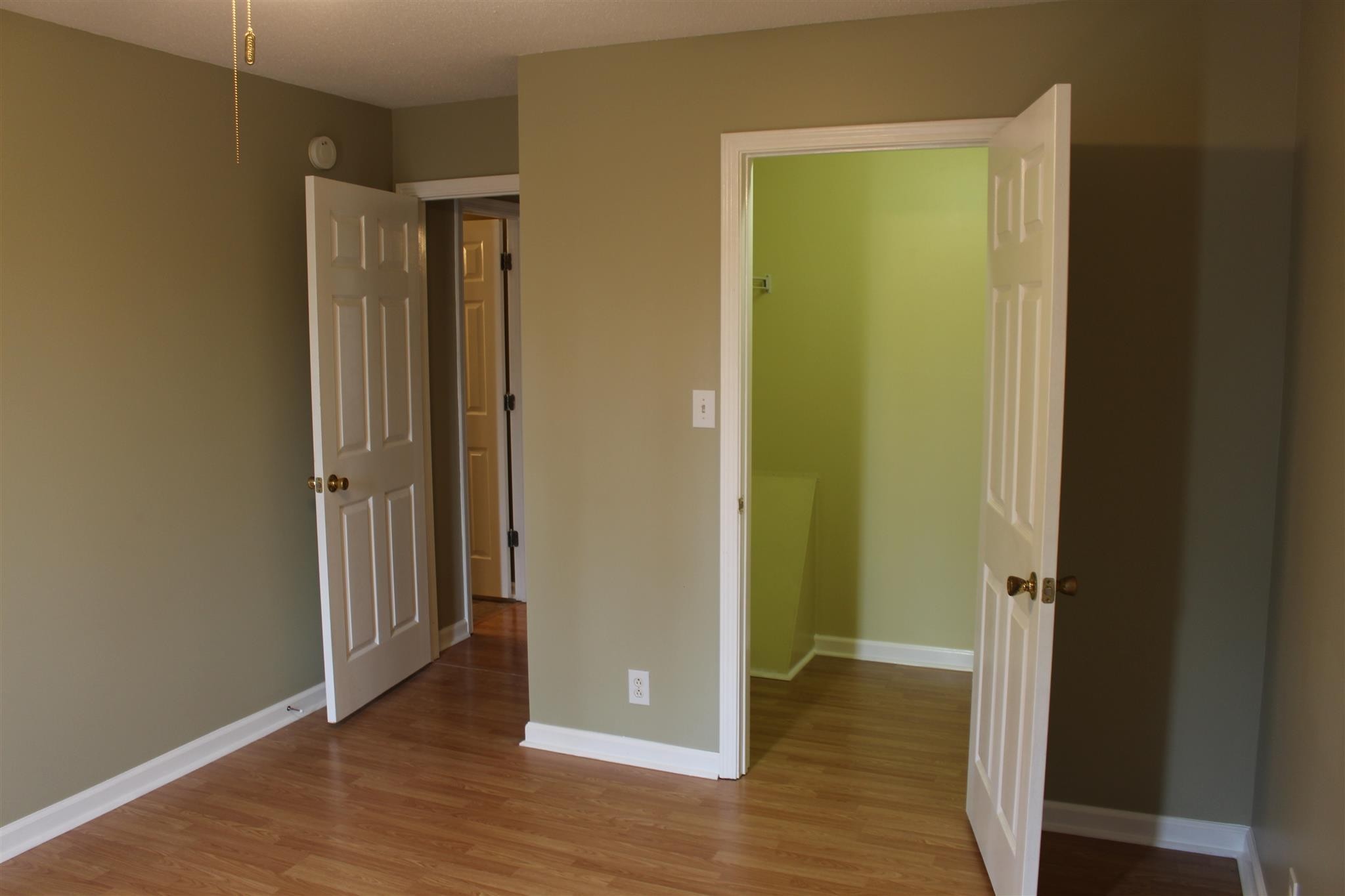 916 Granny White Road Clarksville, TN 37040 - Photo 9 of 19 an empty room with wooden floor and entrance