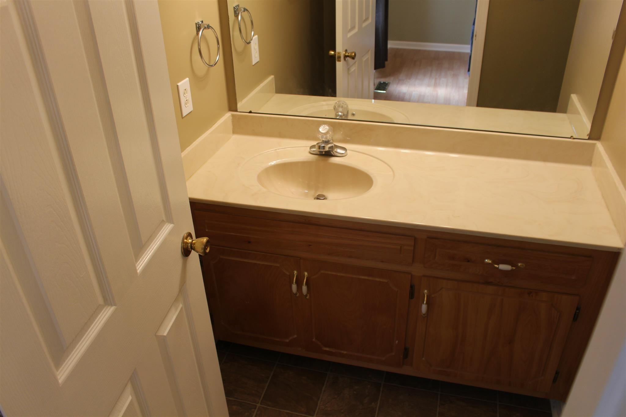 916 Granny White Road Clarksville, TN 37040 - Photo 10 of 19 a bathroom with a sink and a mirror