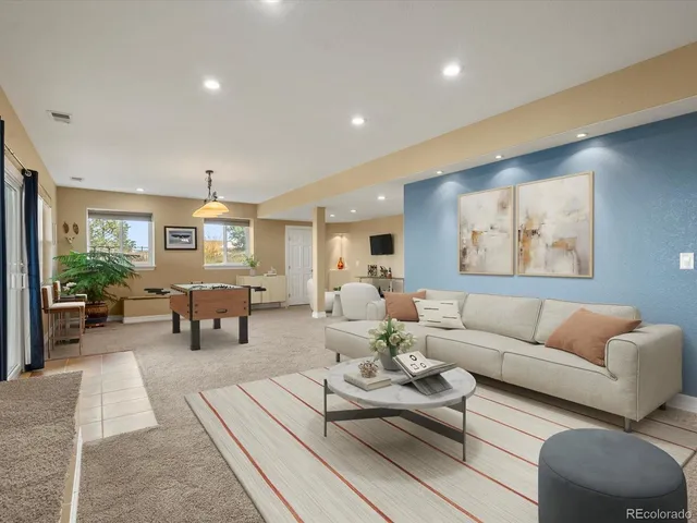 a living room with furniture and a table