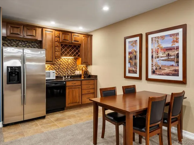 a living room with furniture and a glass door