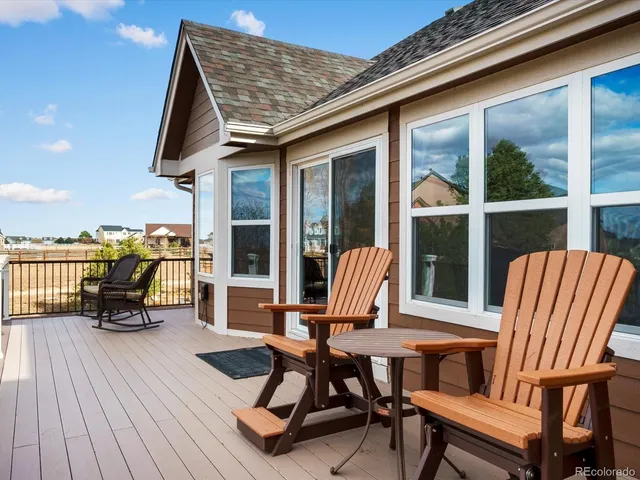 a view of a backyard with sitting area