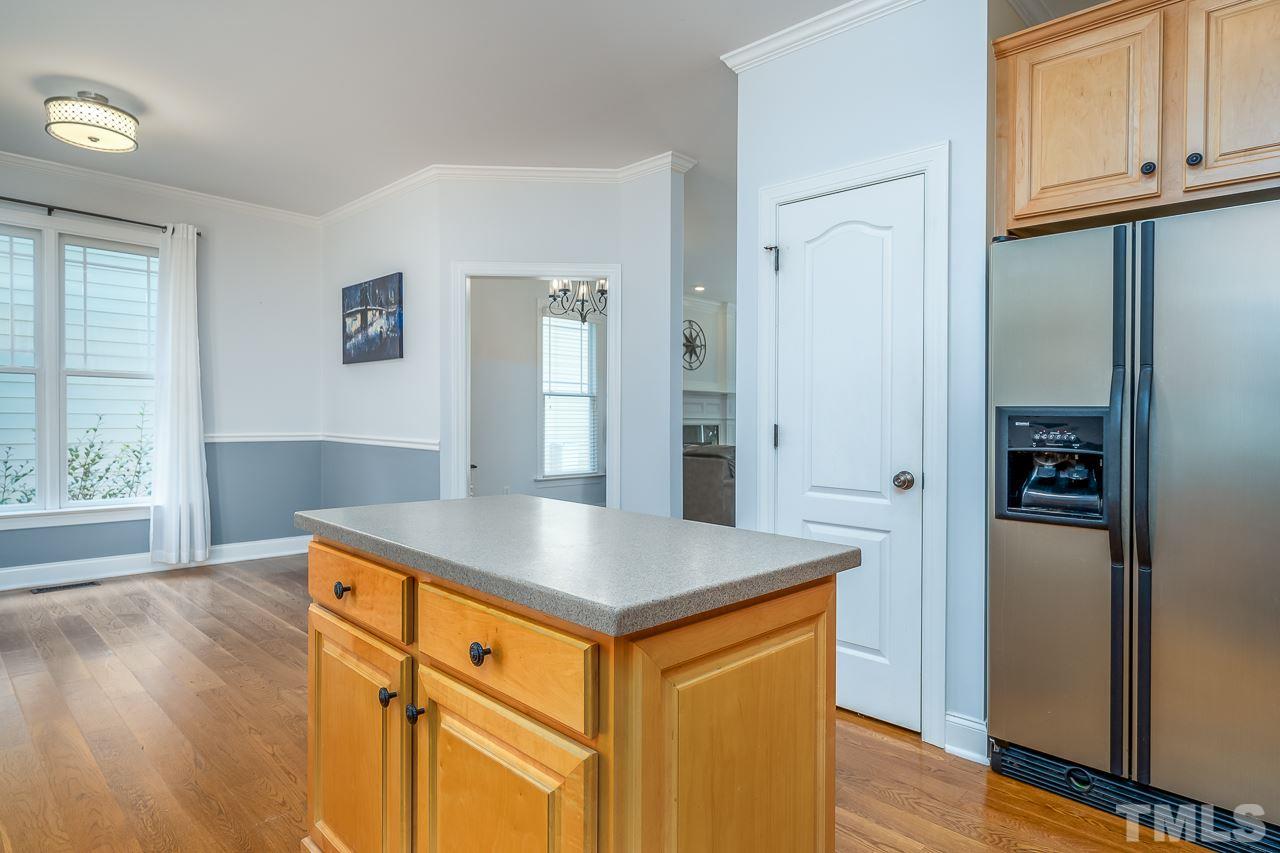 535 Pace Street Raleigh, NC 27604 - Photo 10 of 25 a view of kitchen with furniture and wooden floor