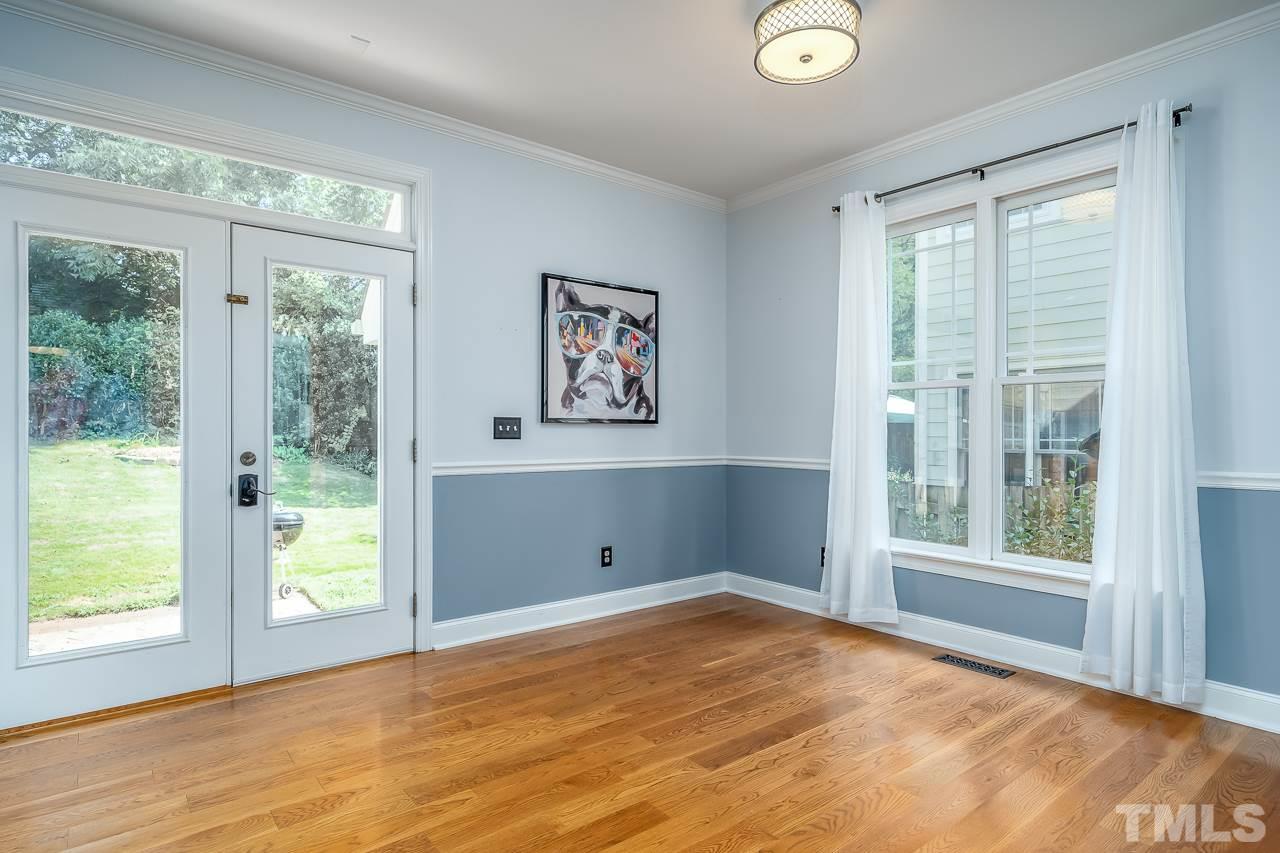 535 Pace Street Raleigh, NC 27604 - Photo 11 of 25 a view of an empty room with wooden floor and a window