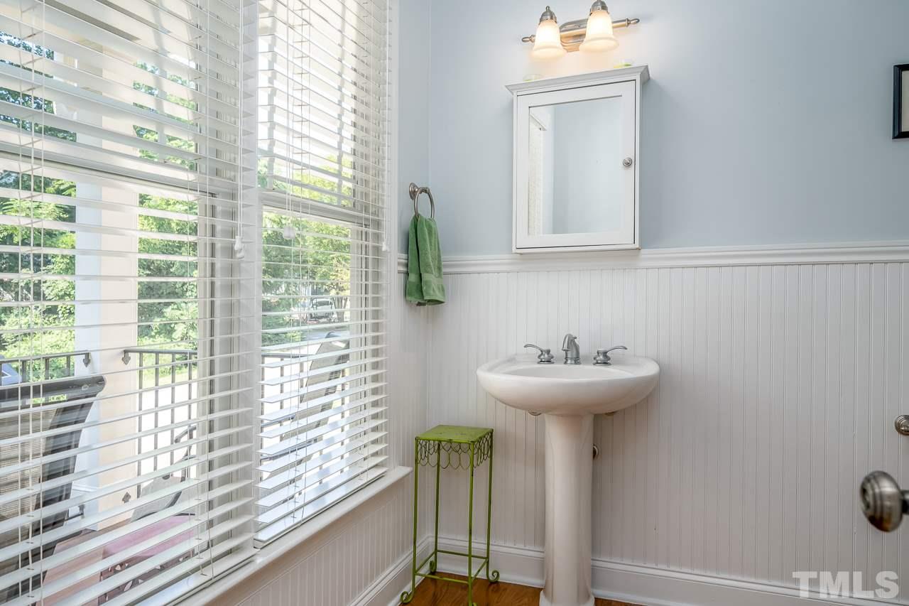 535 Pace Street Raleigh, NC 27604 - Photo 12 of 25 a bathroom with a sink and a mirror