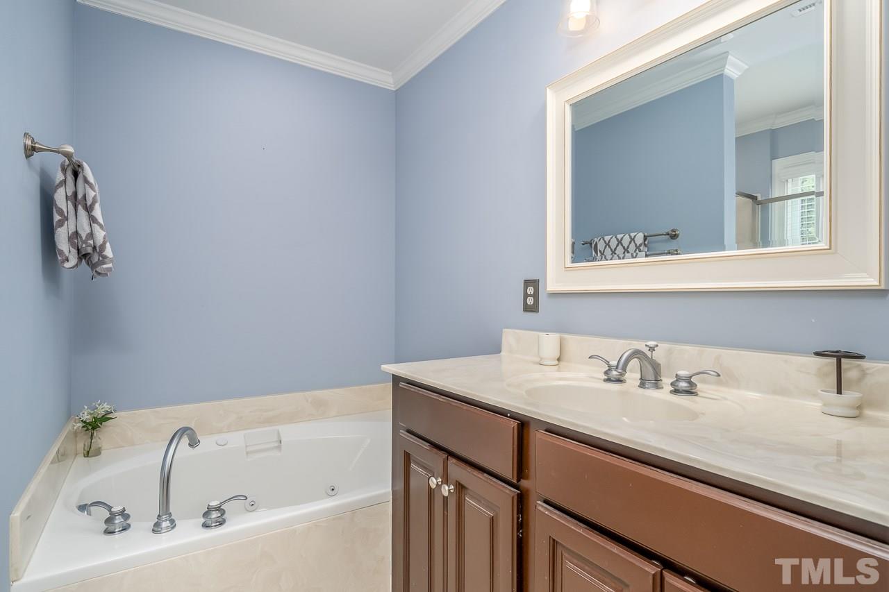 535 Pace Street Raleigh, NC 27604 - Photo 15 of 25 a bathroom with a sink and a bathtub