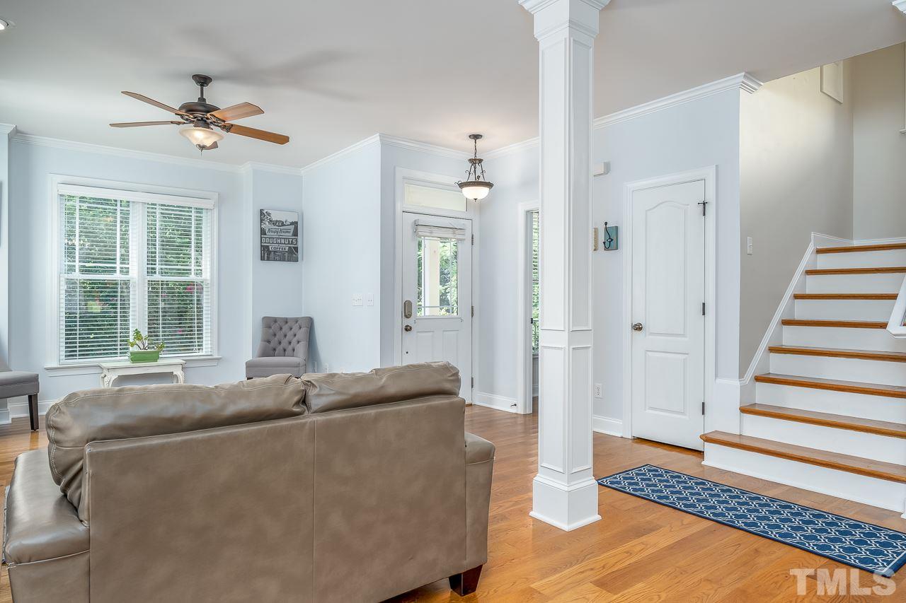 535 Pace Street Raleigh, NC 27604 - Photo 25 of 25 a living room with furniture and a chandelier